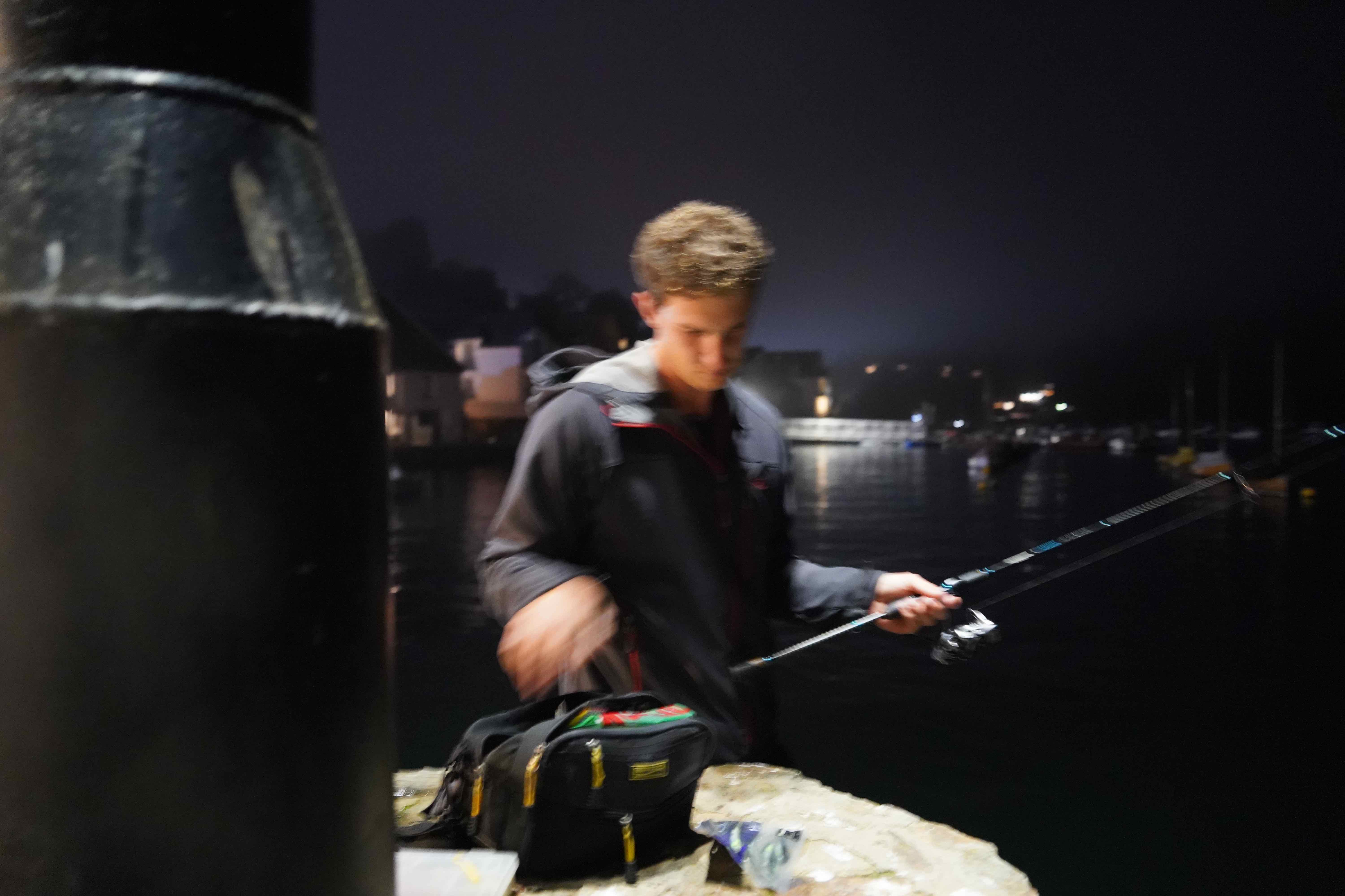 lure fishing at night from a jetty