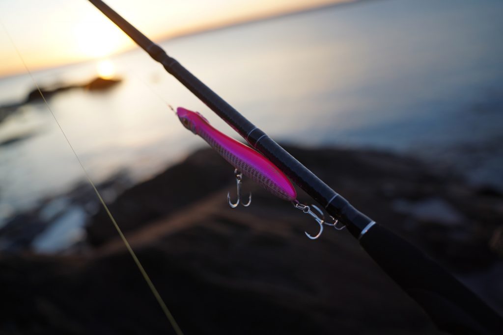surface lure for bass fishing UK, rigged on a lure rod